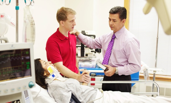 An elder visits a couple at the hospital after the wife was injured in an accident