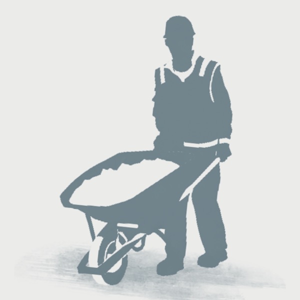 A Kingdom Hall construction servant pushes a wheelbarrow
