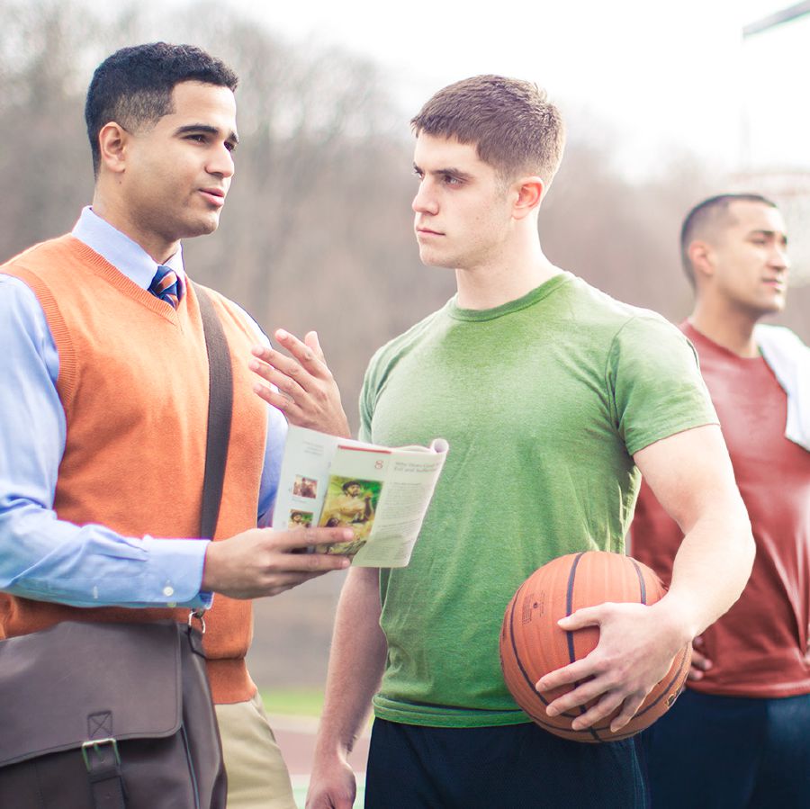 A brother preaches the good news of the Kingdom to a young man