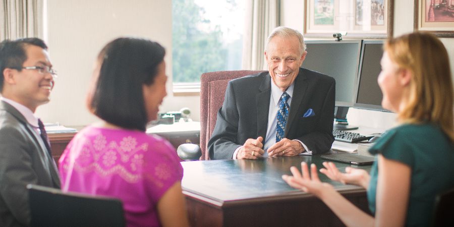 William Samuelson meets with some students