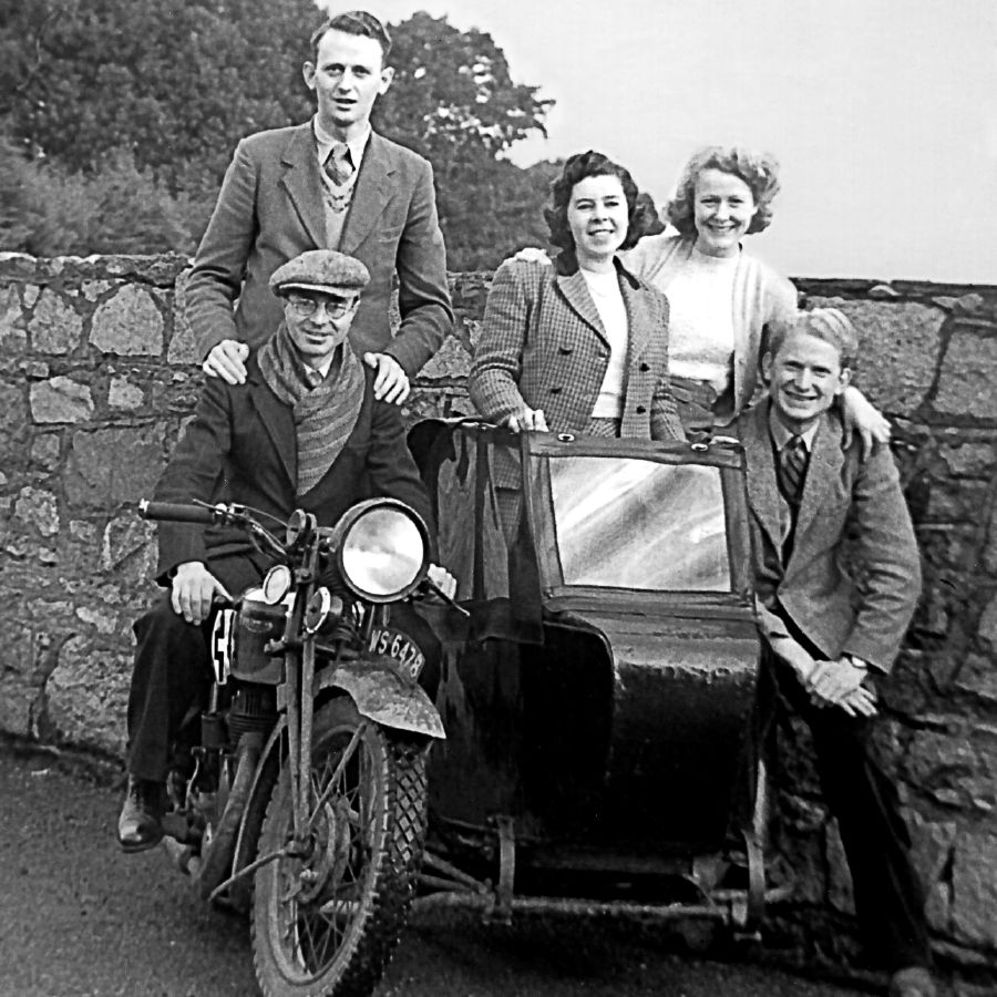 Arthur and Olive Matthews with fellow pioneers on a motorcycle and sidecar