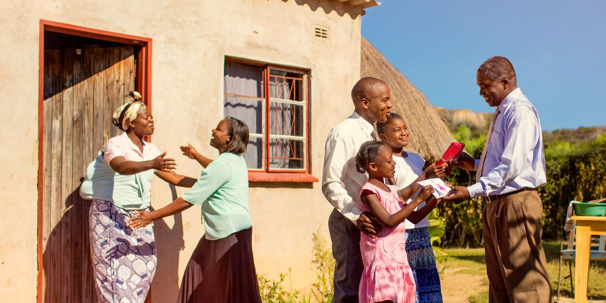 A family welcomes a couple to their home and gives them gifts