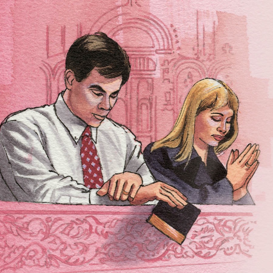 Un matrimonio rezando en una iglesia