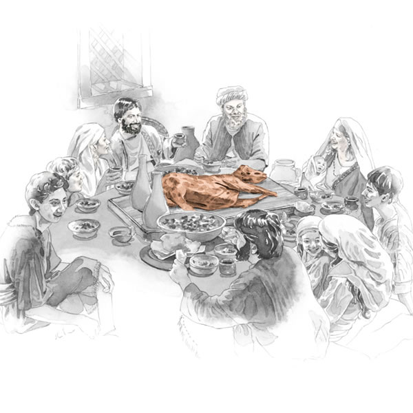 Personas alrededor de una mesa servida, con el cordero de Pascua en el centro