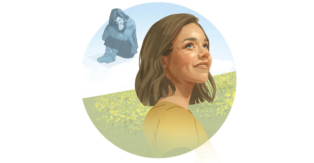 Unha muller que estaba deprimida e acuruxada no chan agora está de pé e sorrí.