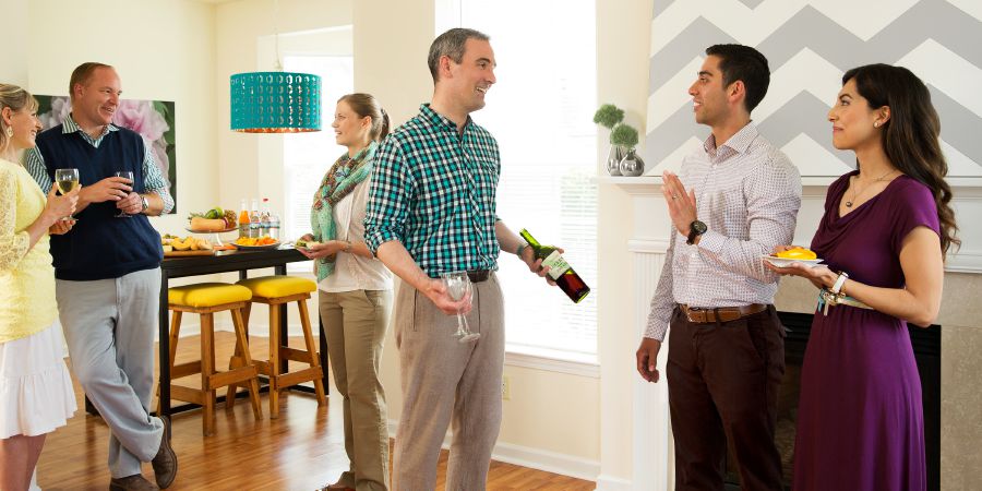 A brother declines a glass of wine at a party