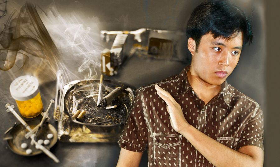 男性がたばこや薬物など汚れた習慣をきっぱり避けている。