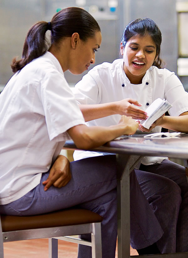 Two women studying the Bible during a break at work