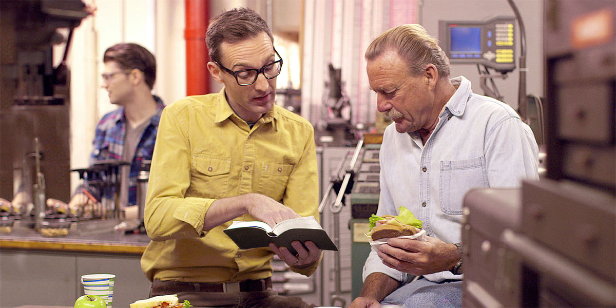 The brother reading one Bible verse to one man to his working place the time they were having break.