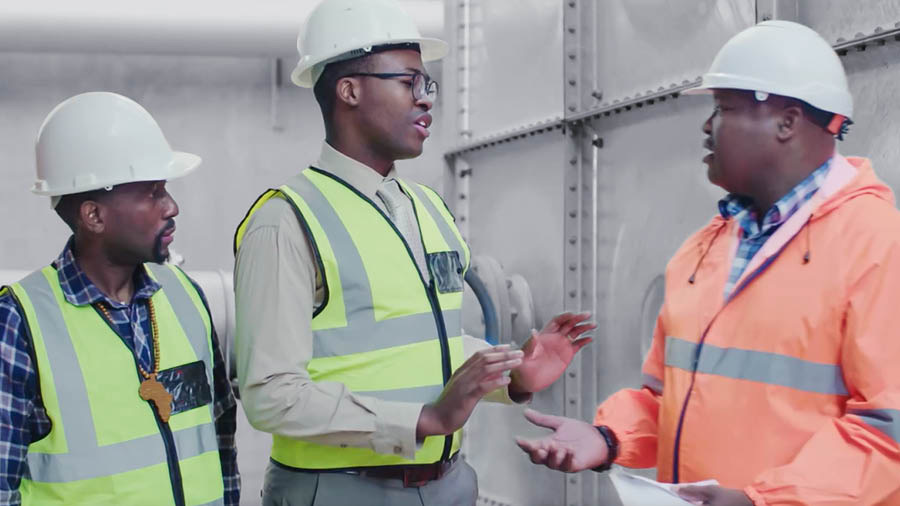 Picture from the video “Work Whole-Souled for Jehovah.” Thomas looking at Jason refusing to accept bribe to his working place.