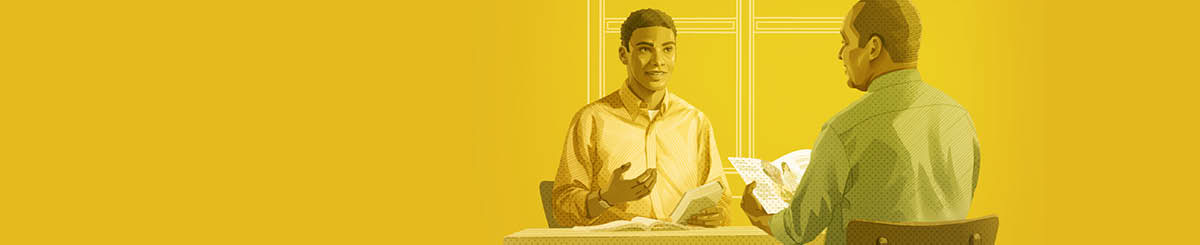 Jehovos liudytojas veda vienam vyrui Biblijos studijas.