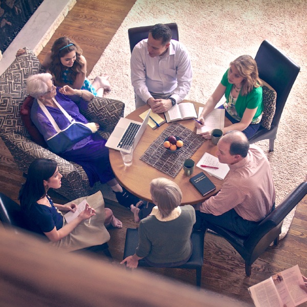 A family meeting with an elderly parent to discuss needs and strategies