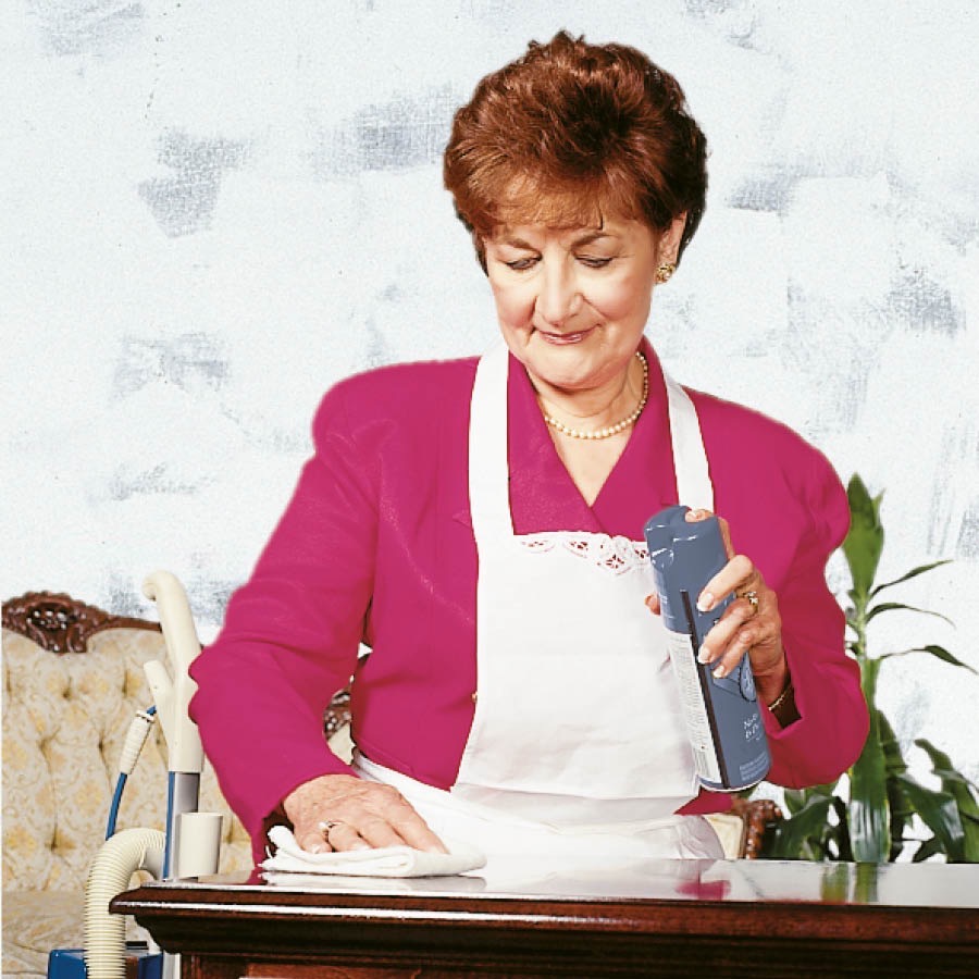 A woman cleans her house