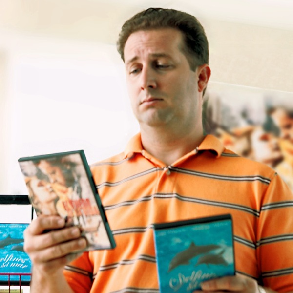 A man deciding which movie to rent or buy