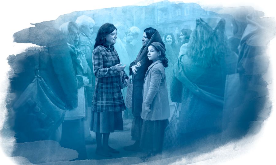 Et Jehovas vitne forkynner for folk som står i brødkø
