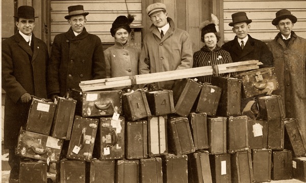 Bible Students and boxes of equipment used to present the Photo-Drama of Creation