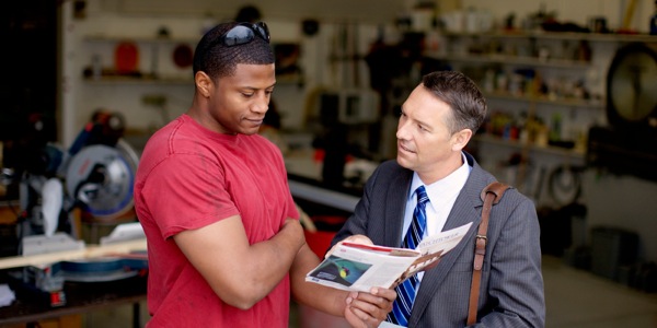 Anthony and Tim having a Bible discussion using the Watchtower magazine