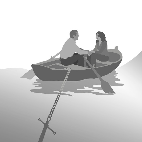 Um casal sentado num barco que está ancorado