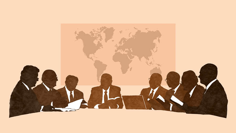 Membros do Corpo Governante fazendo uma reunião.