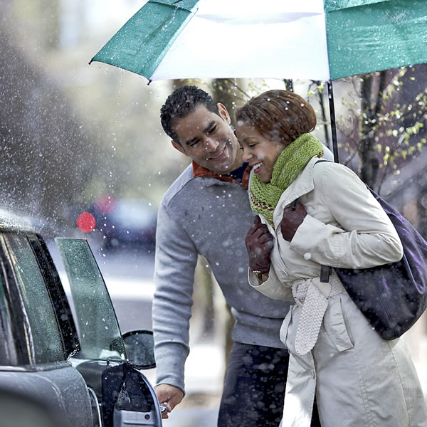 A man opening a door for a woman