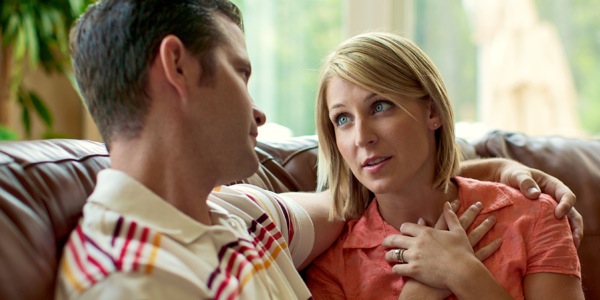 A husband listens as his wife expresses her feelings
