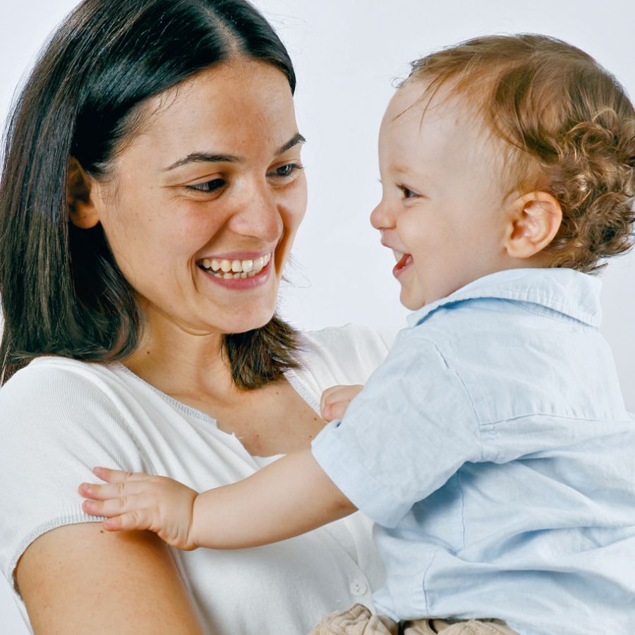 A mother holds her baby